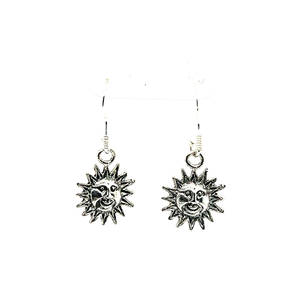 
                  
                    An eye-catching pair of Small Sun with Face Earrings by Super Silver, with an oxidized finish, adding a cosmic touch, beautifully displayed on a clean white background.
                  
                