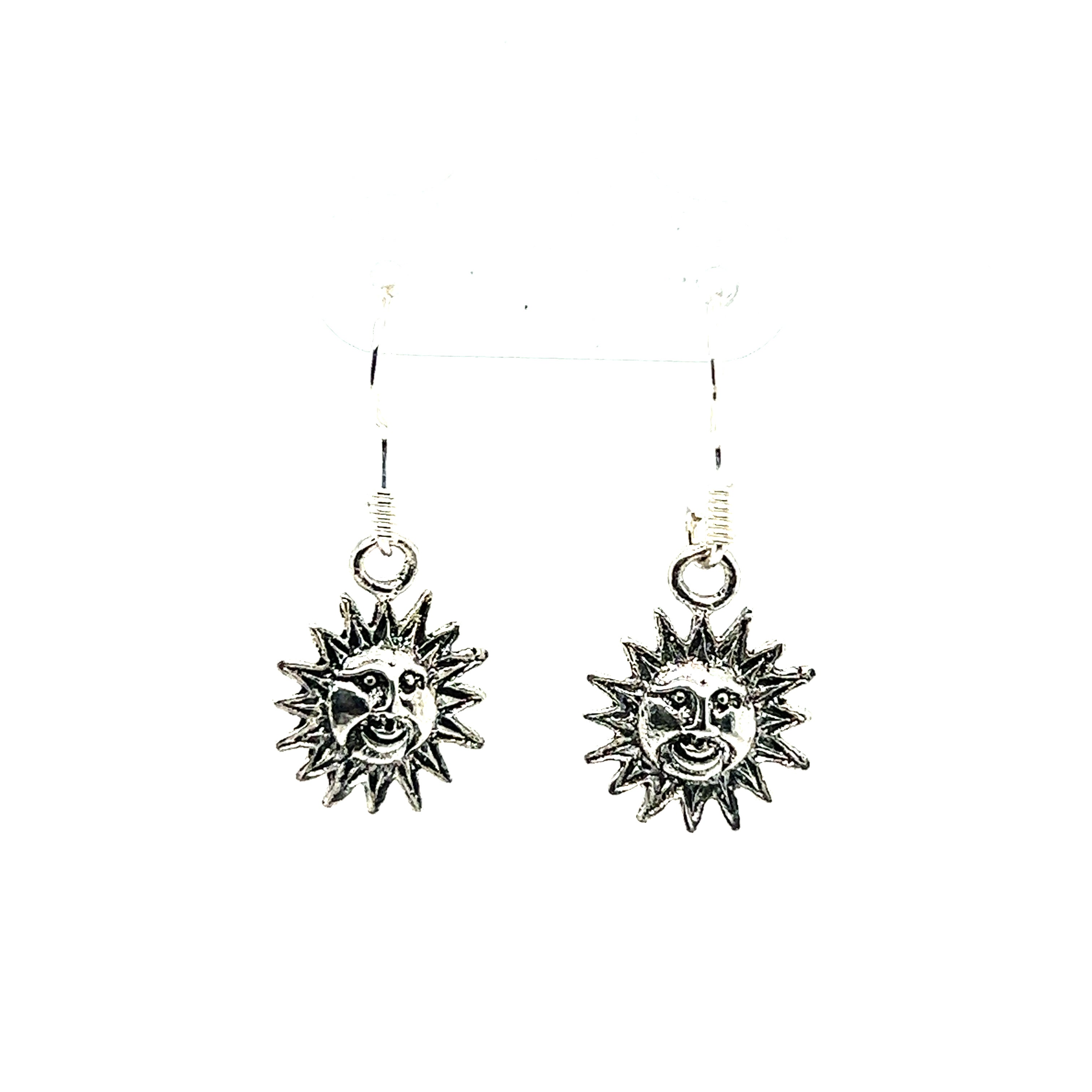An eye-catching pair of Small Sun with Face Earrings by Super Silver, with an oxidized finish, adding a cosmic touch, beautifully displayed on a clean white background.