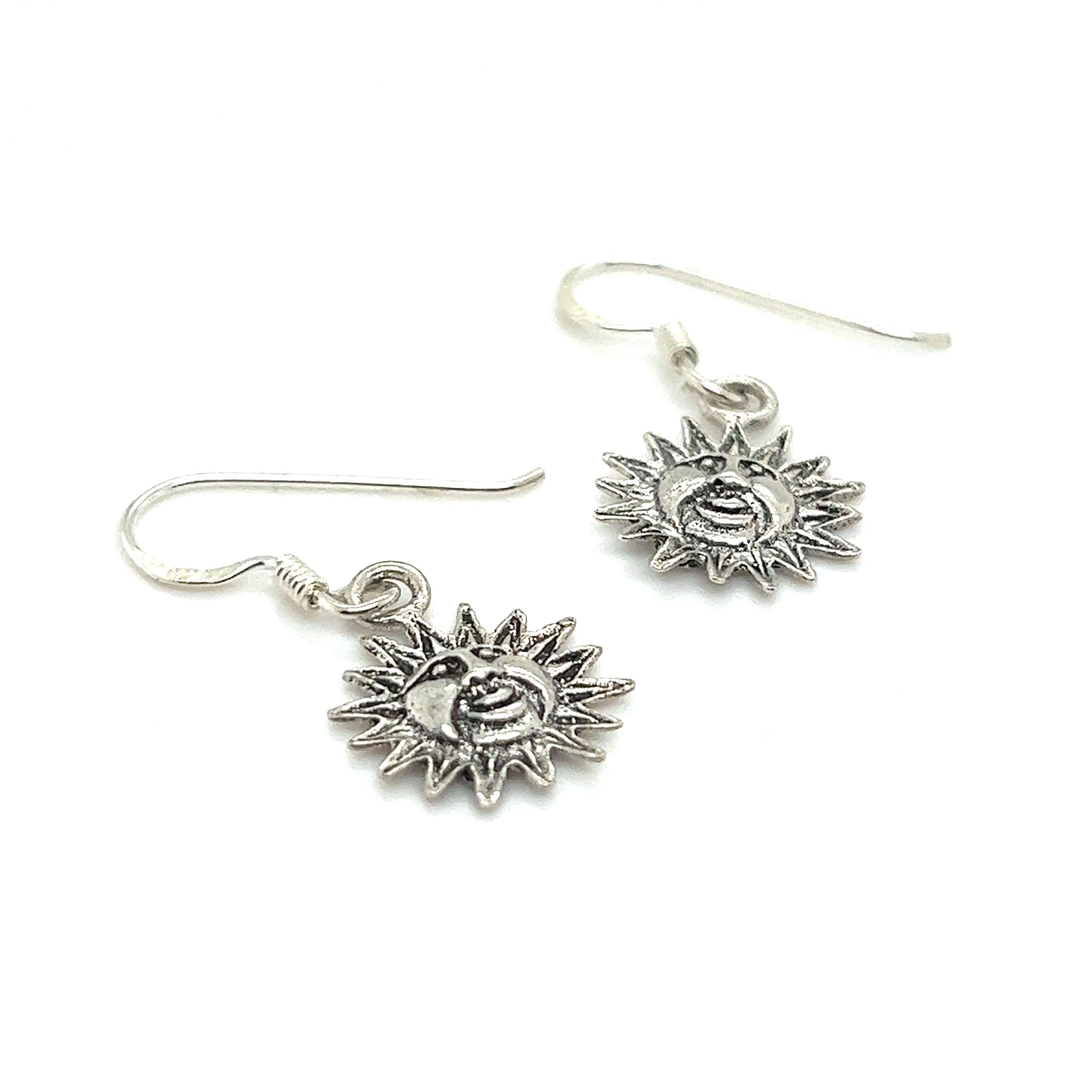 A pair of Small Sun with Face earrings from Super Silver with an oxidized finish.