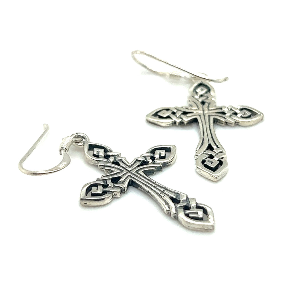 A pair of Super Silver Celtic Knot Cross Earrings, symbolizing eternity, on a white background.