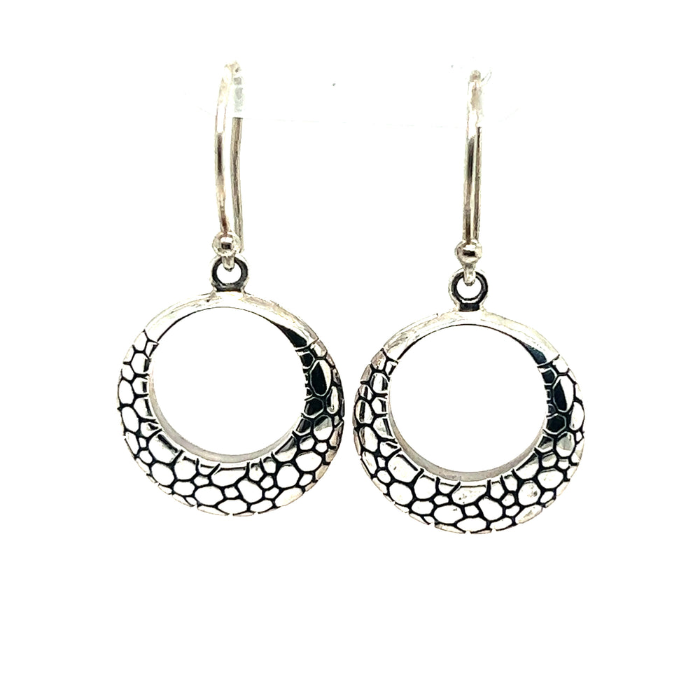 
                  
                    A pair of Super Silver Silver Cobblestone Circle Earrings featuring a modern charm.
                  
                