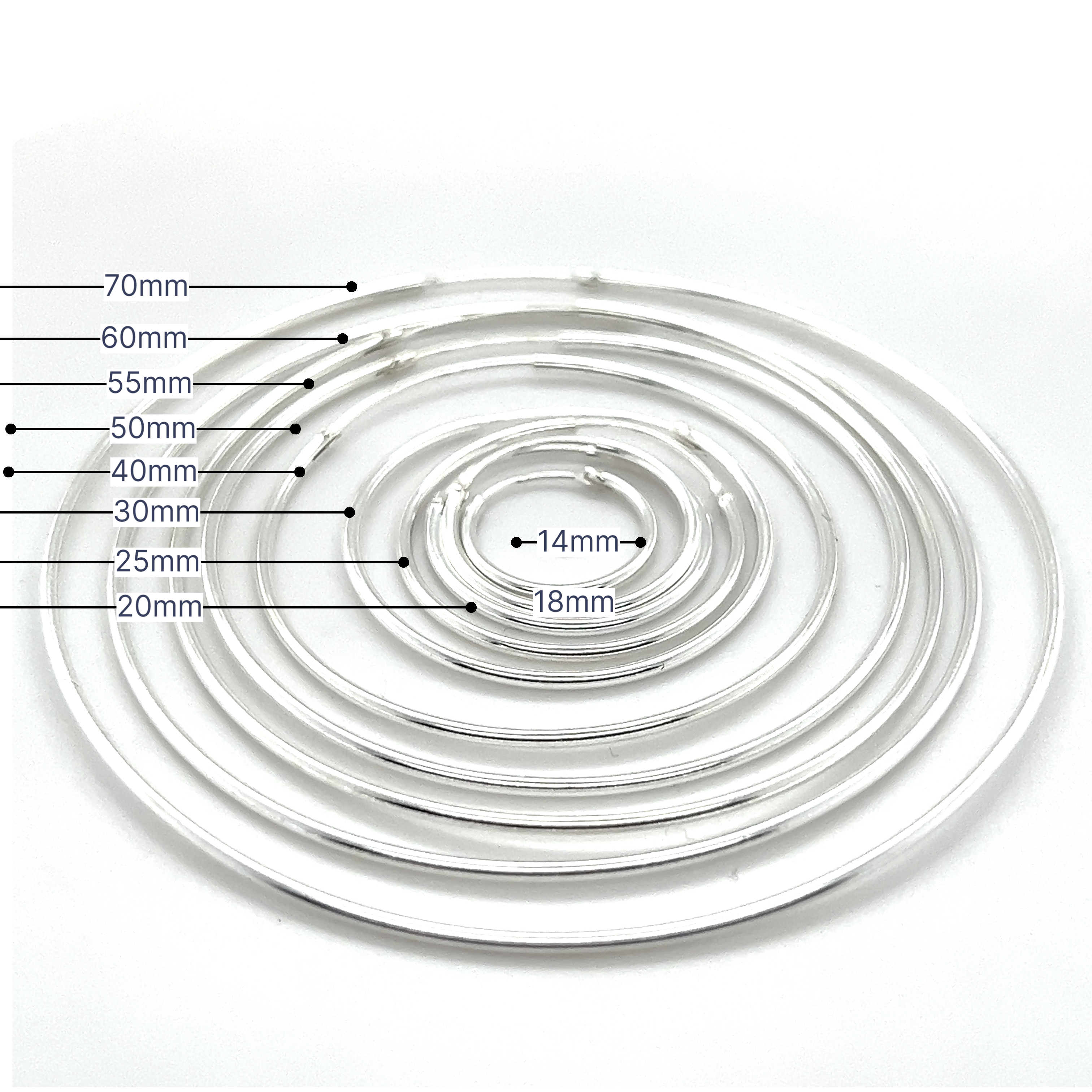 Each concentric circle in the set, designed like the 1.2mm Infinity Hoops, is made with a clear finish and labeled with its diameter in millimeters, ranging from 14mm to 70mm.