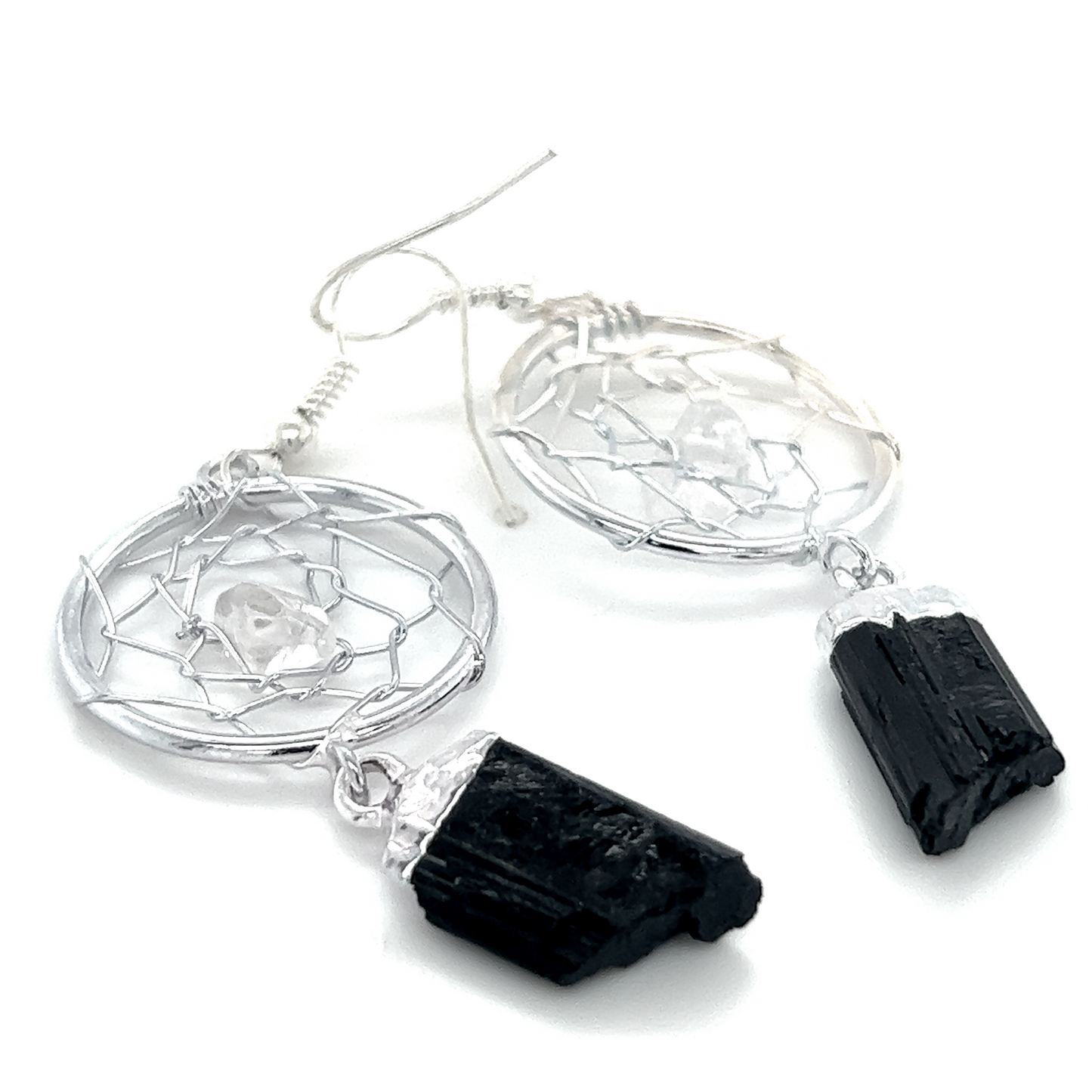 
                  
                    A pair of Raw Crystal Dream Catcher Earrings by Super Silver on a white background, showcasing boho elegance.
                  
                