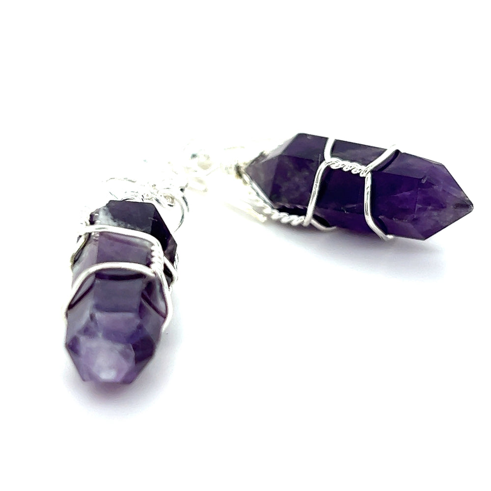 
                  
                    Wire Wrapped Stone Earrings by Super Silver are perfect for everyday wear. These genuine stone earrings feature purple amethyst crystals set in mixed metal.
                  
                