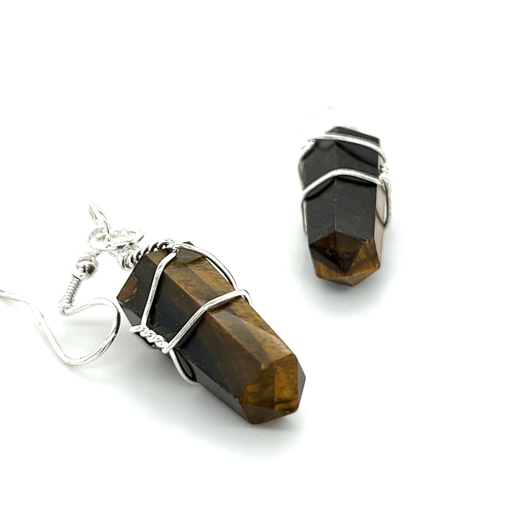 
                  
                    A pair of Super Silver Wire Wrapped Stone Earrings with genuine tiger eye stones crafted in mixed metal.
                  
                