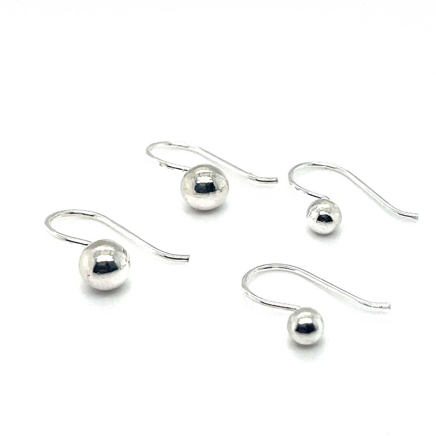Dainty Fixed Ball Earrings by Super Silver on a white background.
