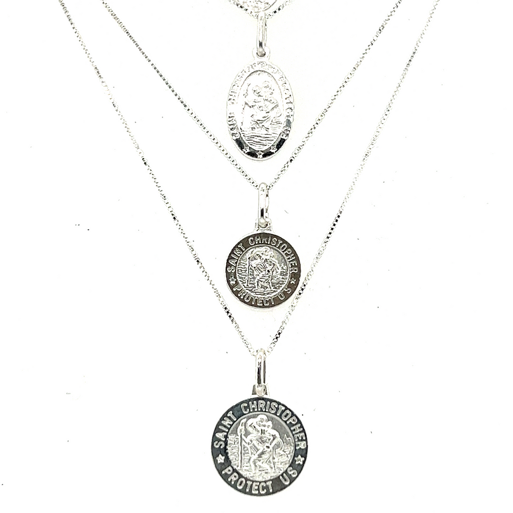 
                  
                    Super Silver's St John the Baptist necklace features medals of Saint Christopher, the patron saint of travelers, made with their Saint Christopher Medallion available in various sizes.
                  
                