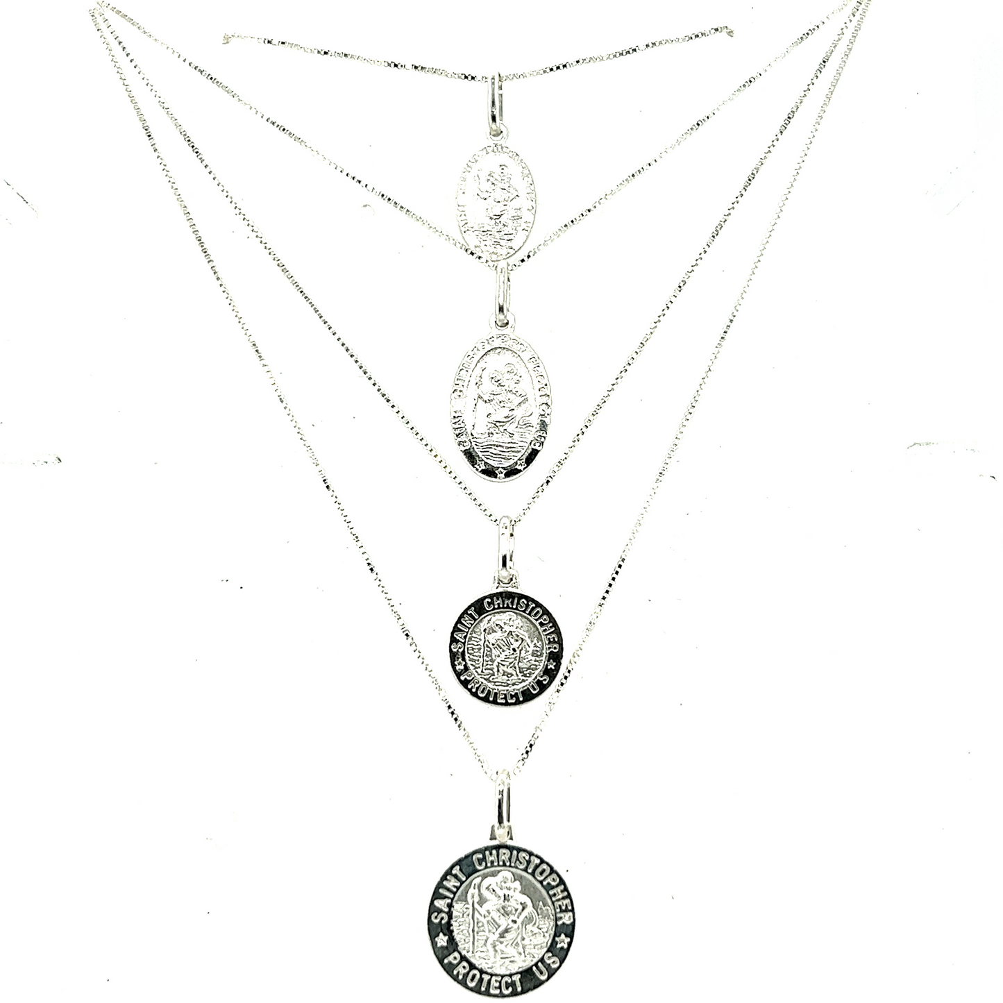 A silver necklace with three Super Silver Saint Christopher Medallions In Various Sizes, the patron saint of travelers, on it.