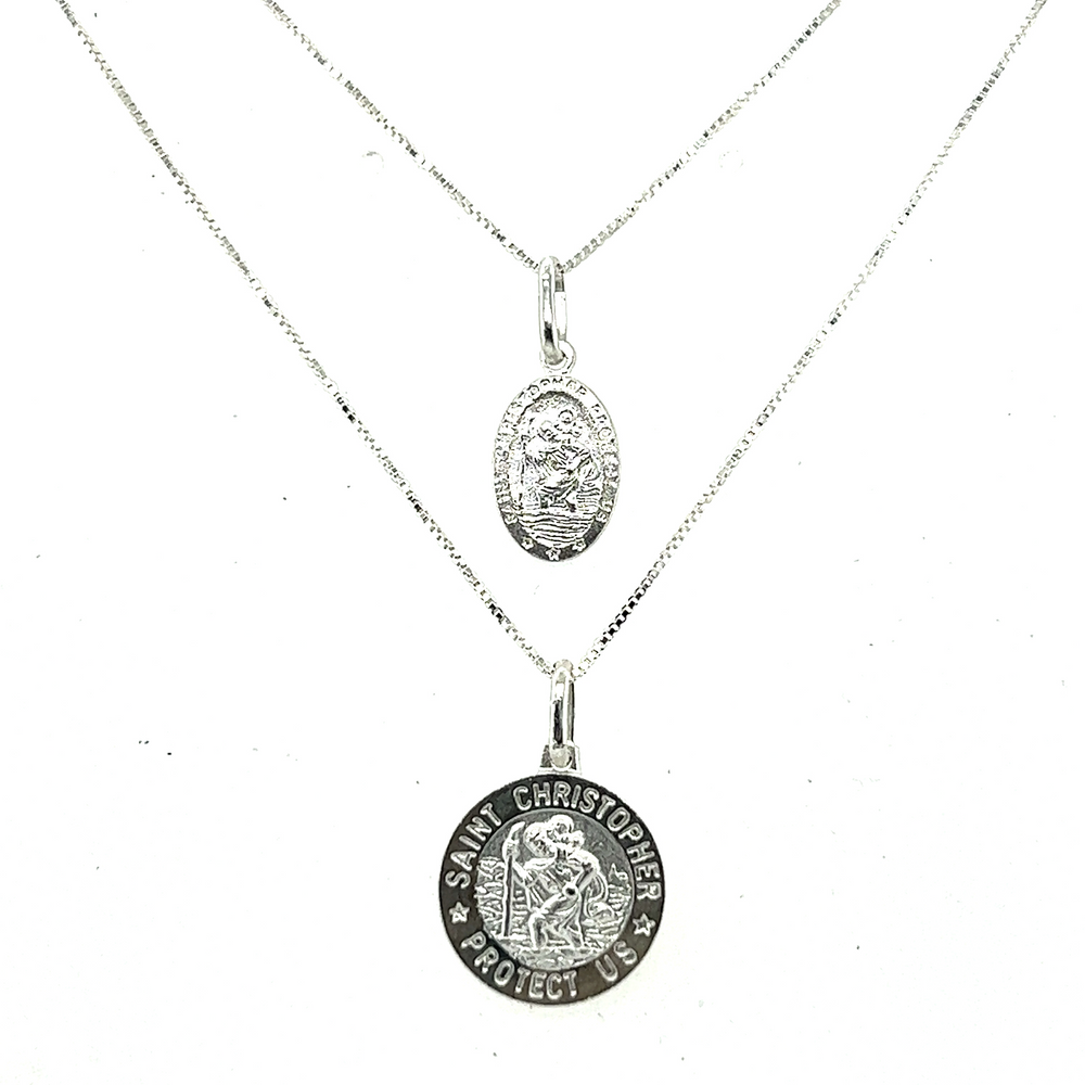 Super Silver's Saint Christopher Medallion in Various Sizes, featuring a depiction of the patron saint of travelers, is a pendant necklace that can be compared to the St. John the Baptist pendant necklace in sterling silver.