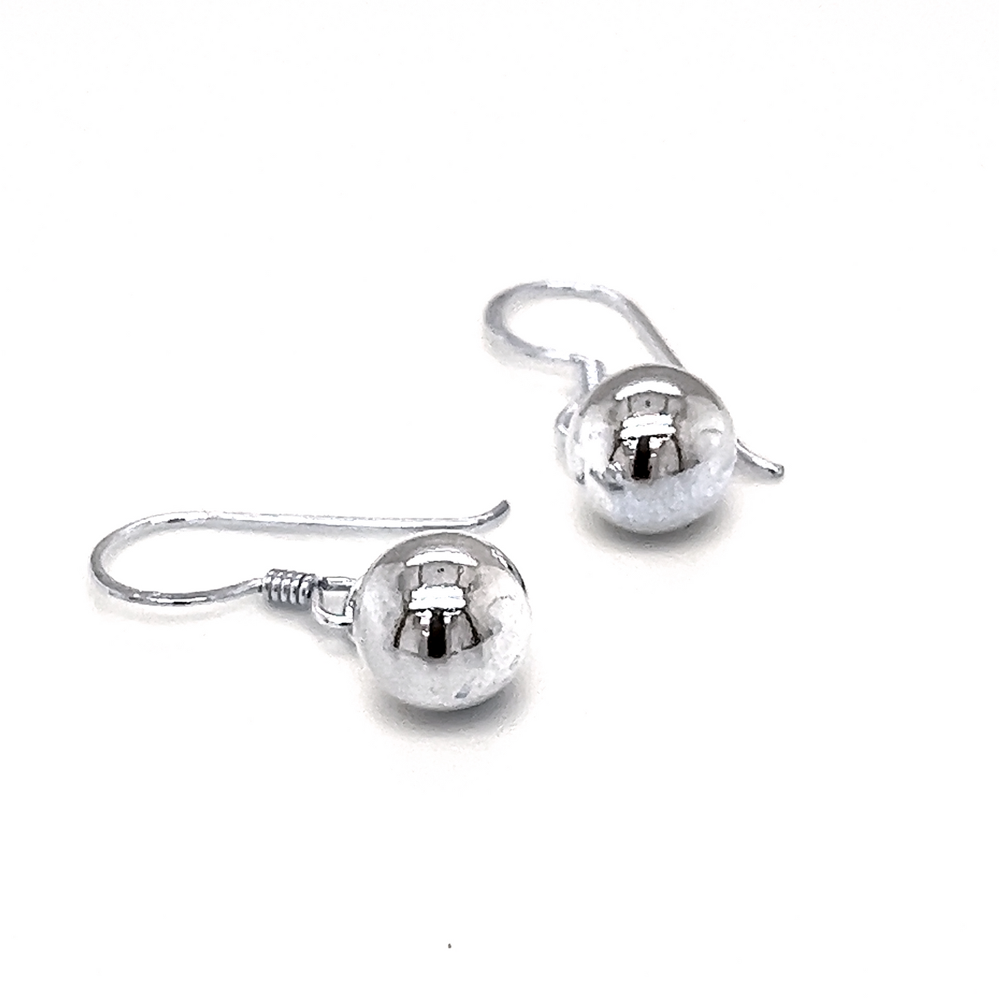 
                  
                    A pair of Simple Dangling Ball Earrings from Super Silver with understated glamour on a white background.
                  
                