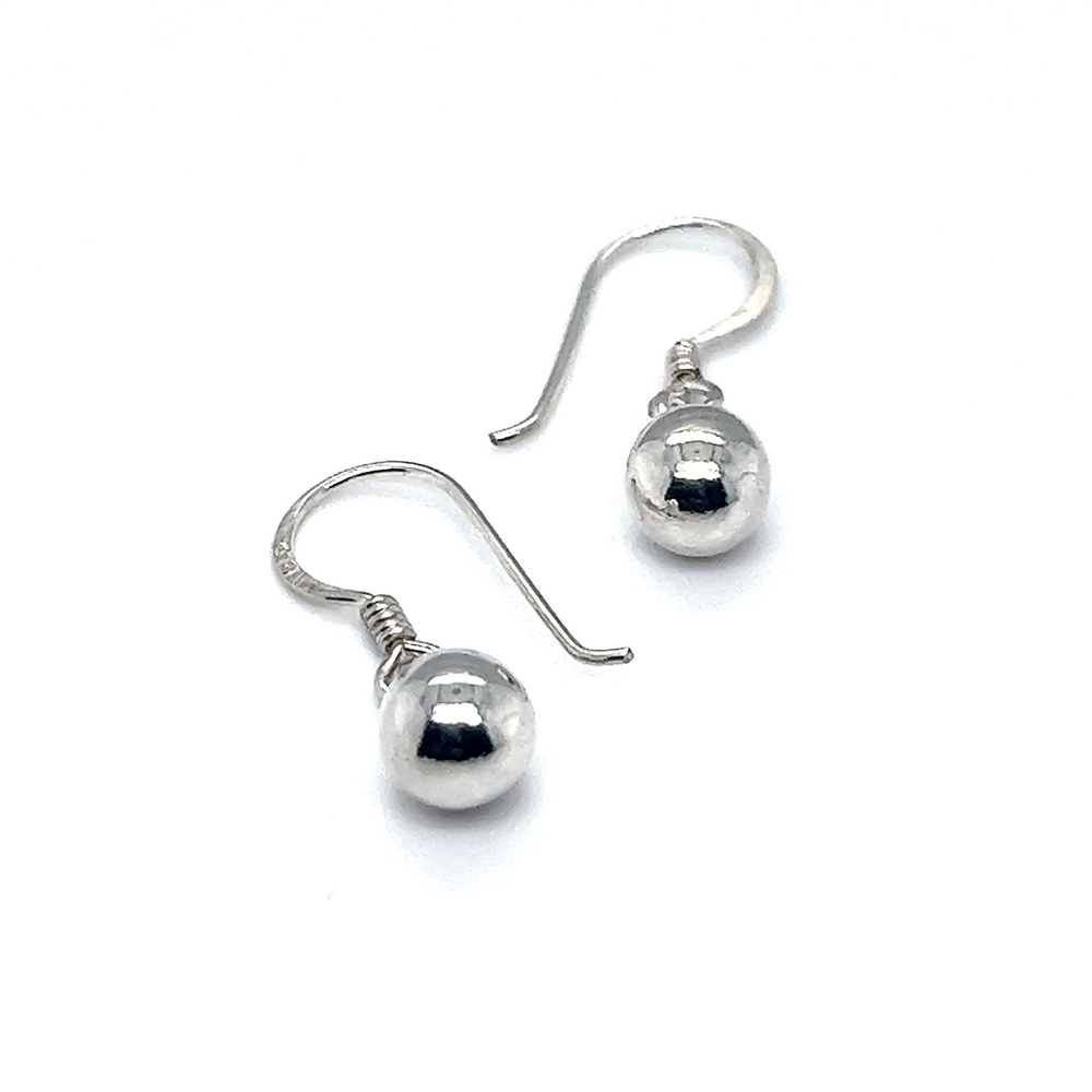 
                  
                    Super Silver's Simple Dangling Ball Earrings on a white background.
                  
                
