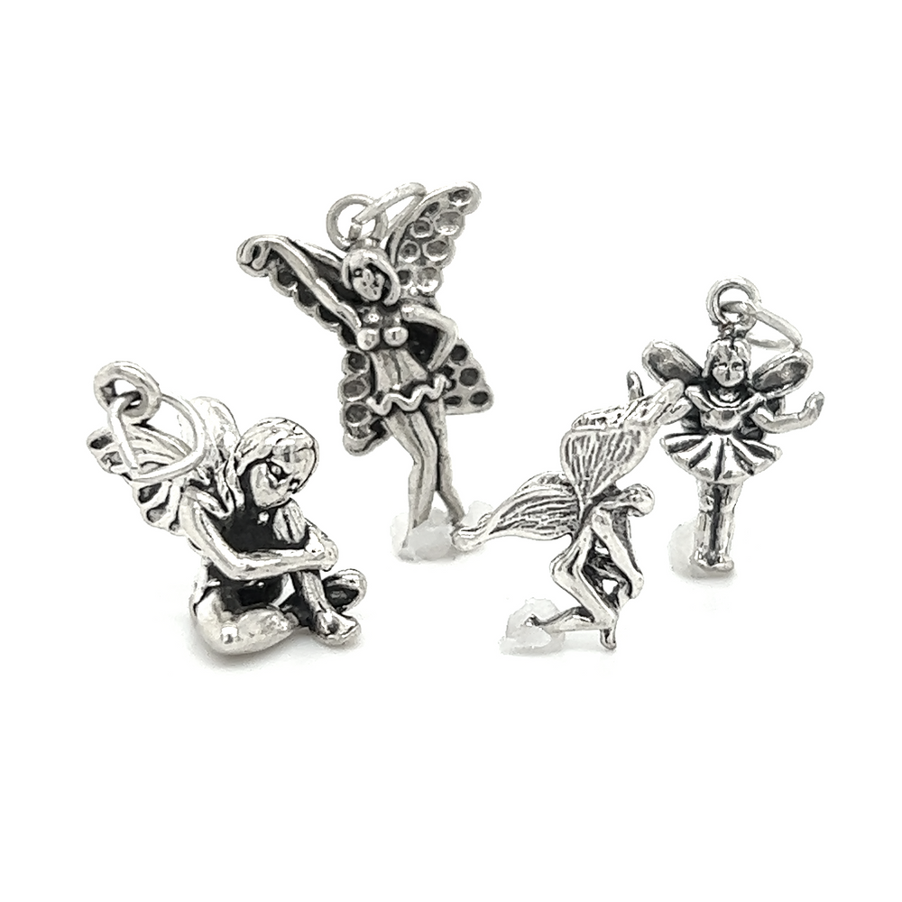 Three Super Silver fairy charms, exuding enchantment and magic, showcased against a pristine white background.