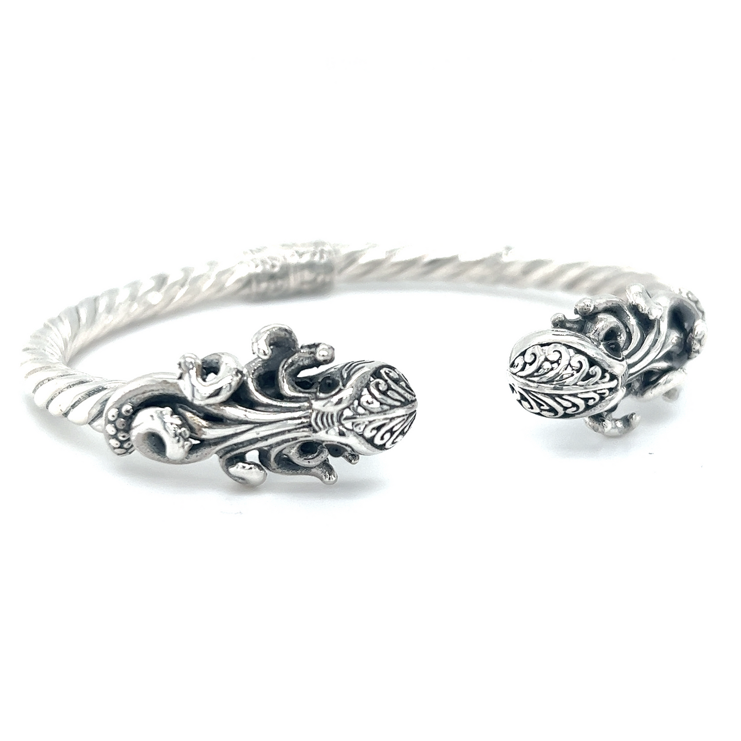 A Twisted Bangle Bracelet with Octopus Ends by Super Silver, with an ornate design.