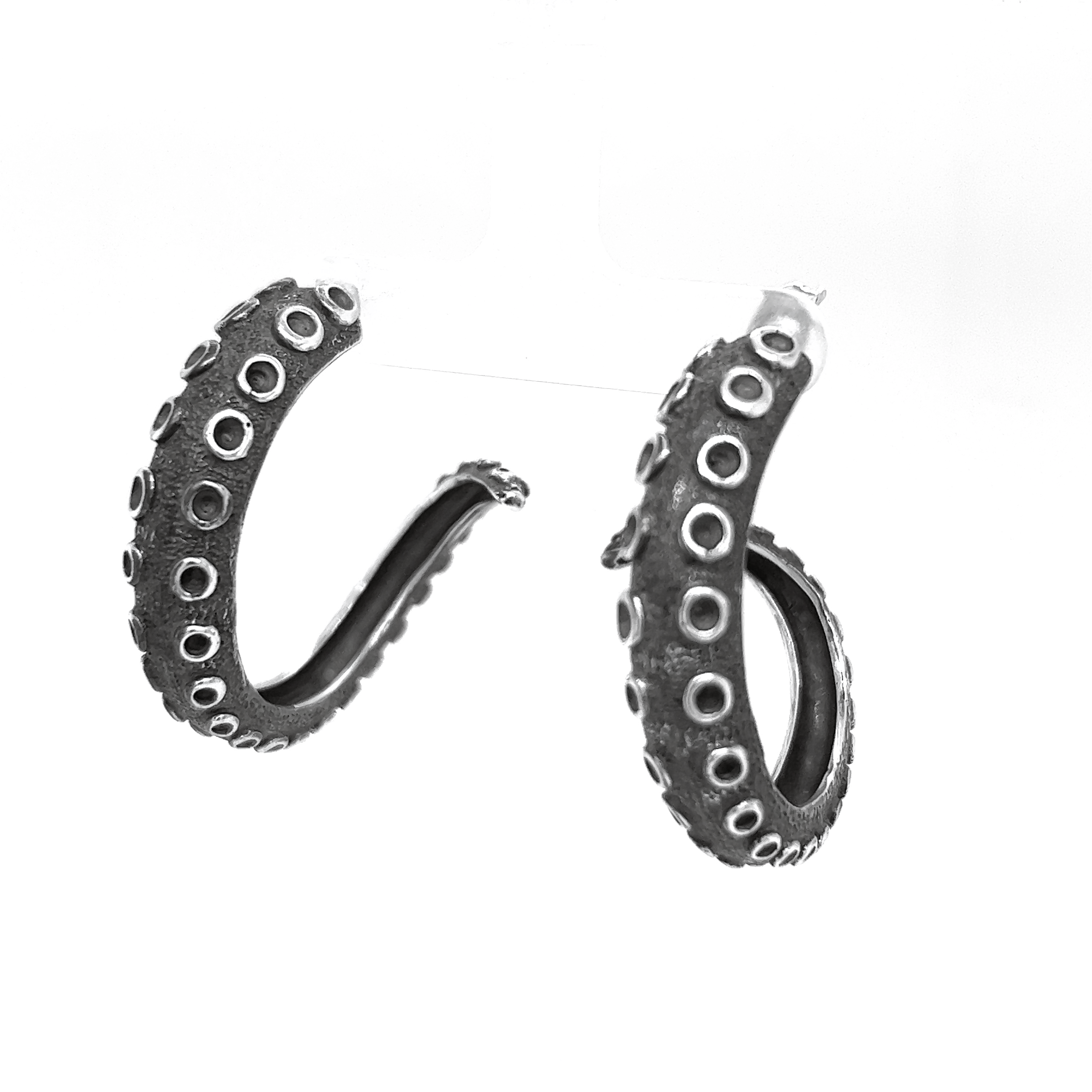 A pair of Super Silver Edgy Octopus Tentacle Hoop Earrings showcasing oceanic charm on a white background.