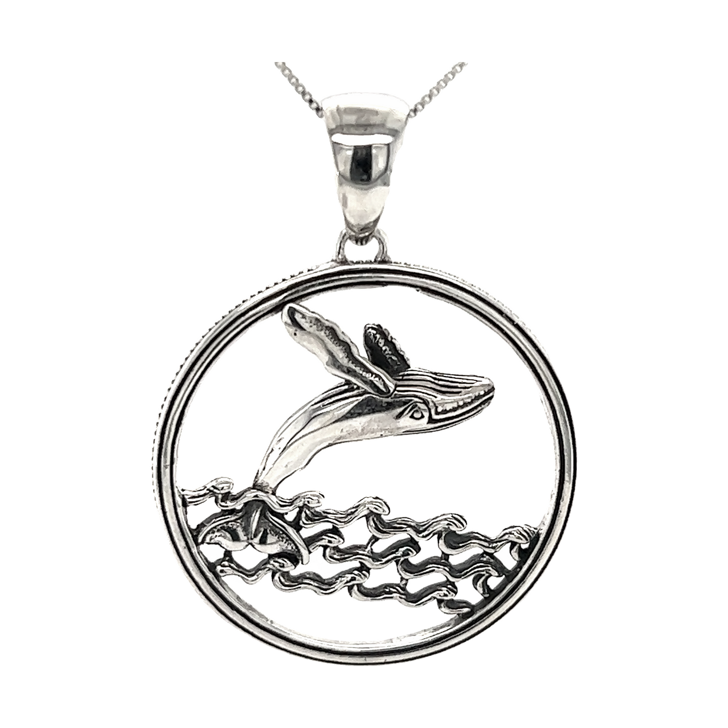 
                  
                    A Brilliant Whale Pendant by Super Silver with a humpback whale in the ocean off Santa Cruz.
                  
                
