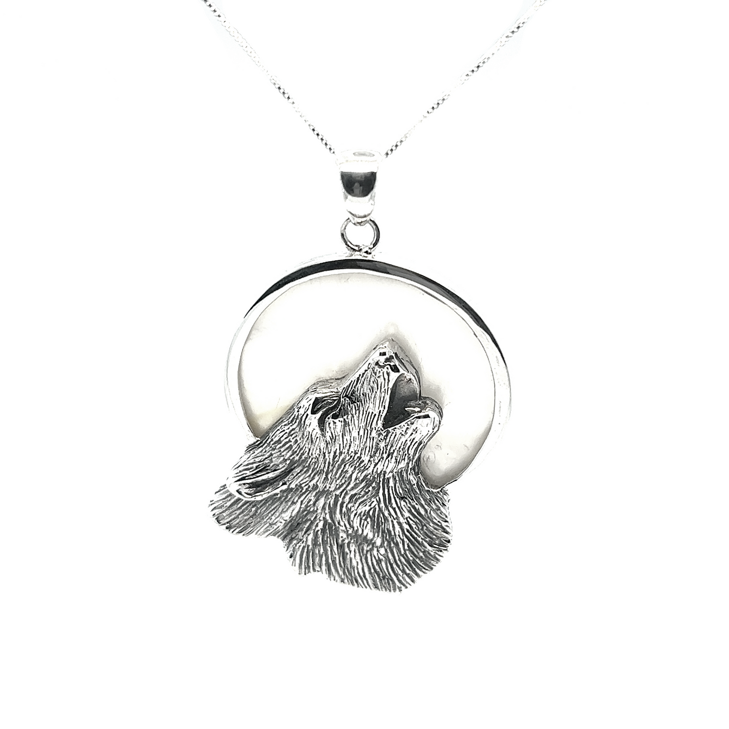 
                  
                    Super Silver's Wolf Howling At The Full Moon pendant in sterling silver.
                  
                