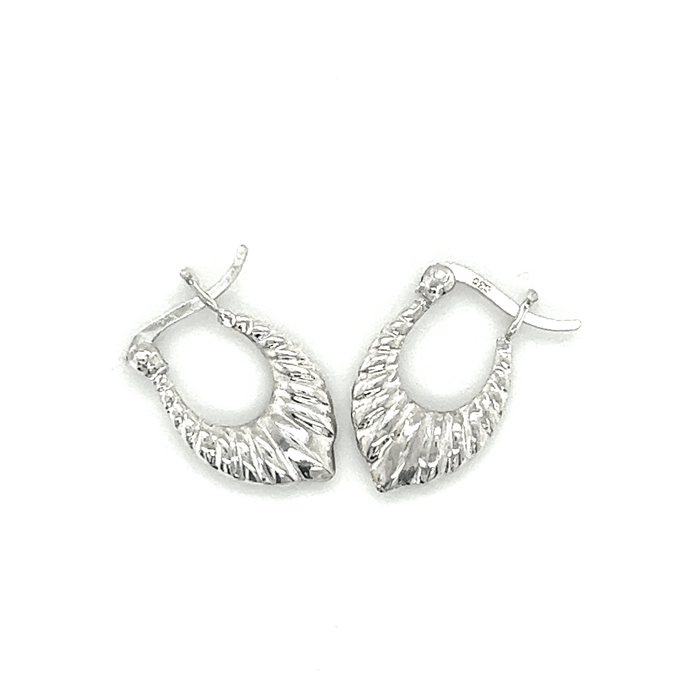 
                  
                    A pair of Super Silver Dainty Latch Hoop Earrings on a white background, perfect for minimalist style.
                  
                