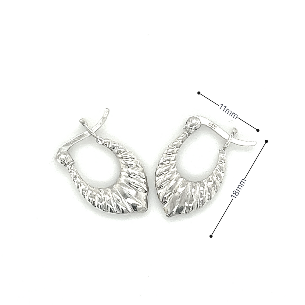 A pair of Super Silver Dainty Latch Hoop Earrings.