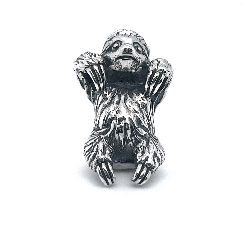 An artisan-crafted Super Silver sloth pendant on a white background, showcasing impeccable craftsmanship.