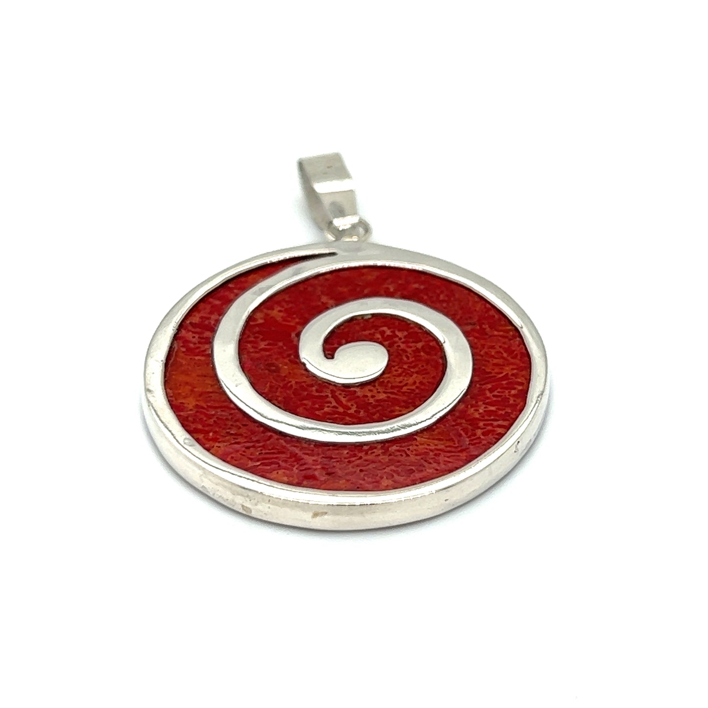 
                  
                    A Coral Spiral Pendant with a spiral design featuring a red hue and made with .925 Sterling Silver.
                  
                