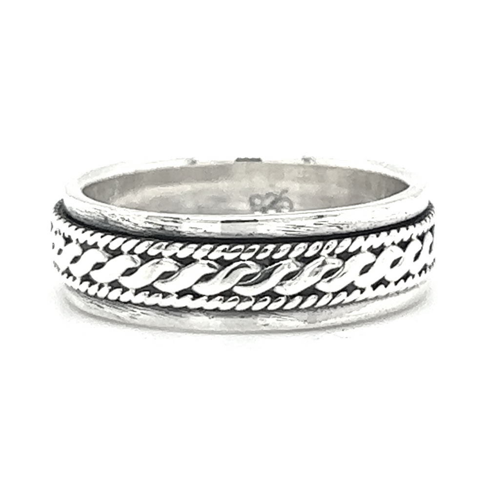 A silver spinner ring with a rope design.
