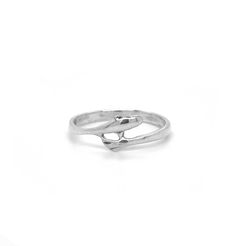 A sterling silver Tiny Dolphin Ring with a diamond in the middle, inspired by the oceanic wonders of Santa Cruz.