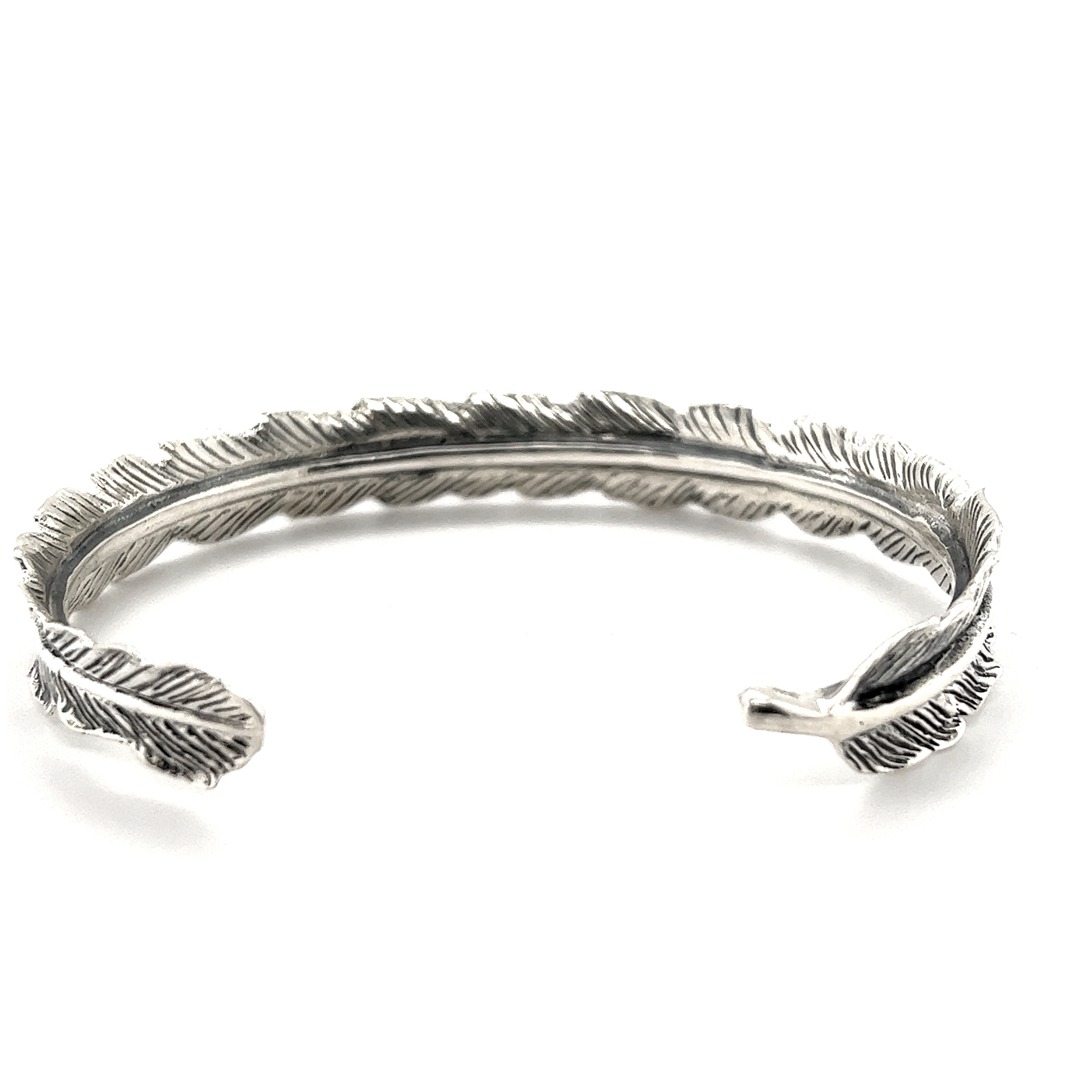 A Detailed Feather Cuff with a vintage feel, exuding an earthy vibe.