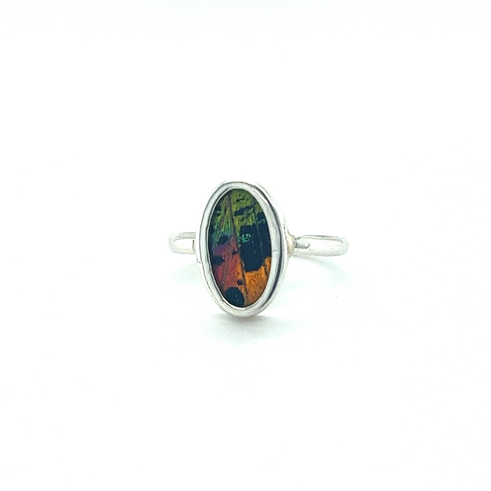 
                  
                    A vibrant and eye-catching Genuine Butterfly Wing Ring in Oval Shape featuring a stunning colorful stone.
                  
                