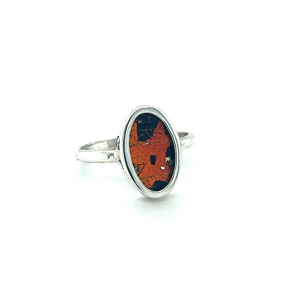 
                  
                    A silver and orange Genuine Butterfly Wing Rings in Oval Shape.
                  
                