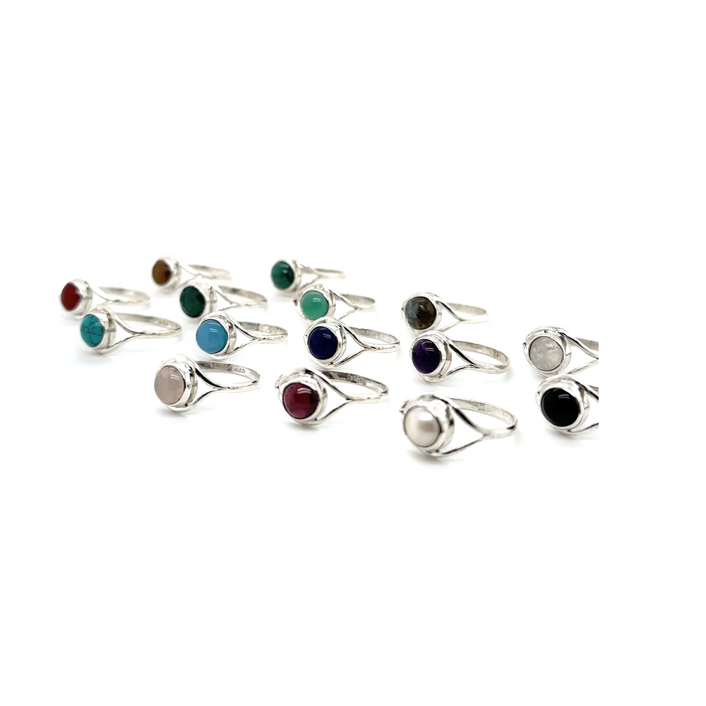 
                  
                    A contemporary aesthetic group of Abstract Stone Eye Rings adorned with gemstones of different colors.
                  
                