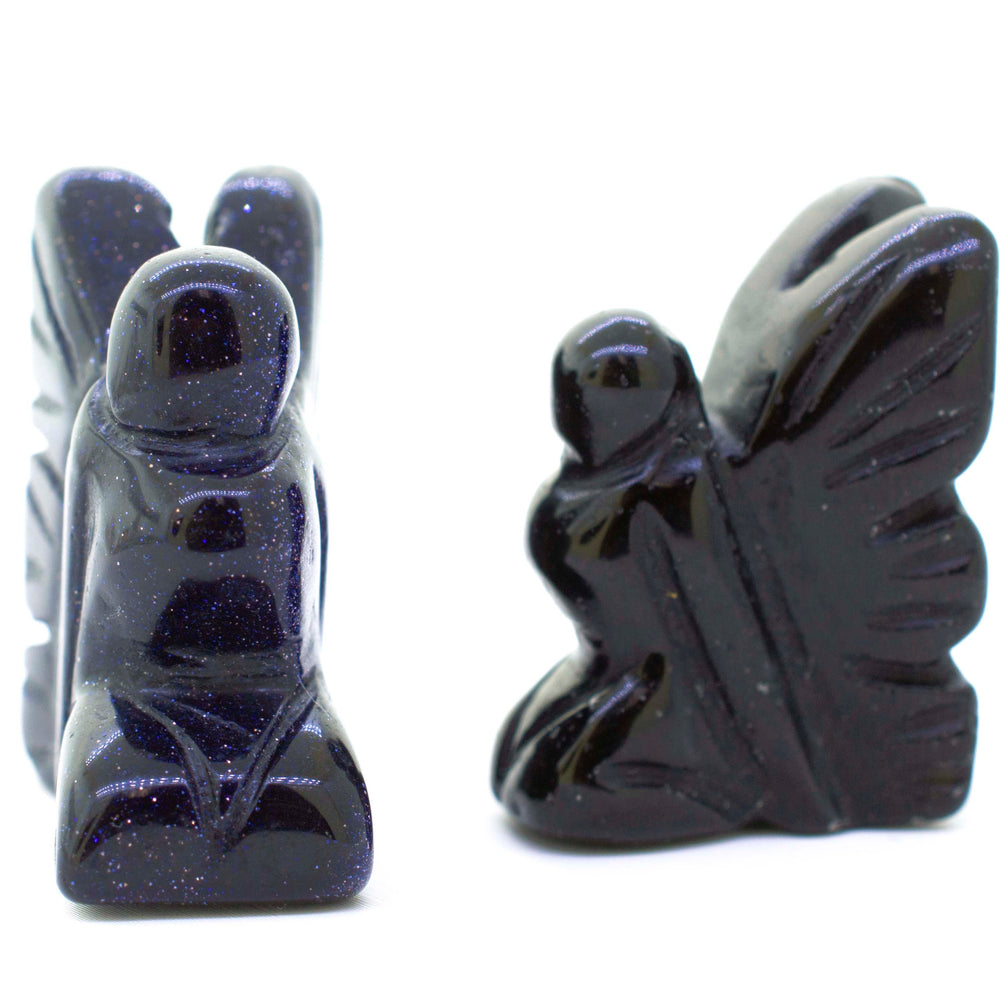 
                  
                    A pair of Carved Fairy Gemstones Figures with wings on them.
                  
                