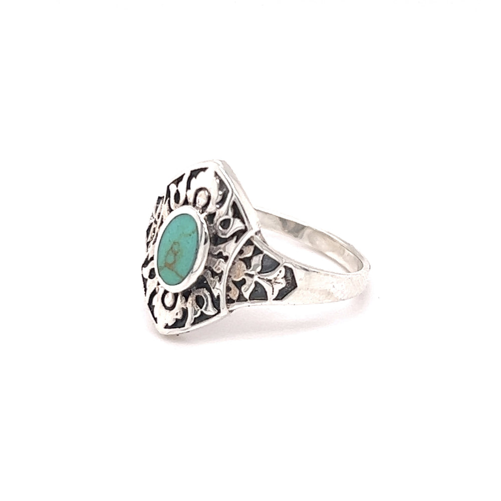 
                  
                    A Marquise Shield Ring With Inlaid Stones with a turquoise stone inlaid.
                  
                