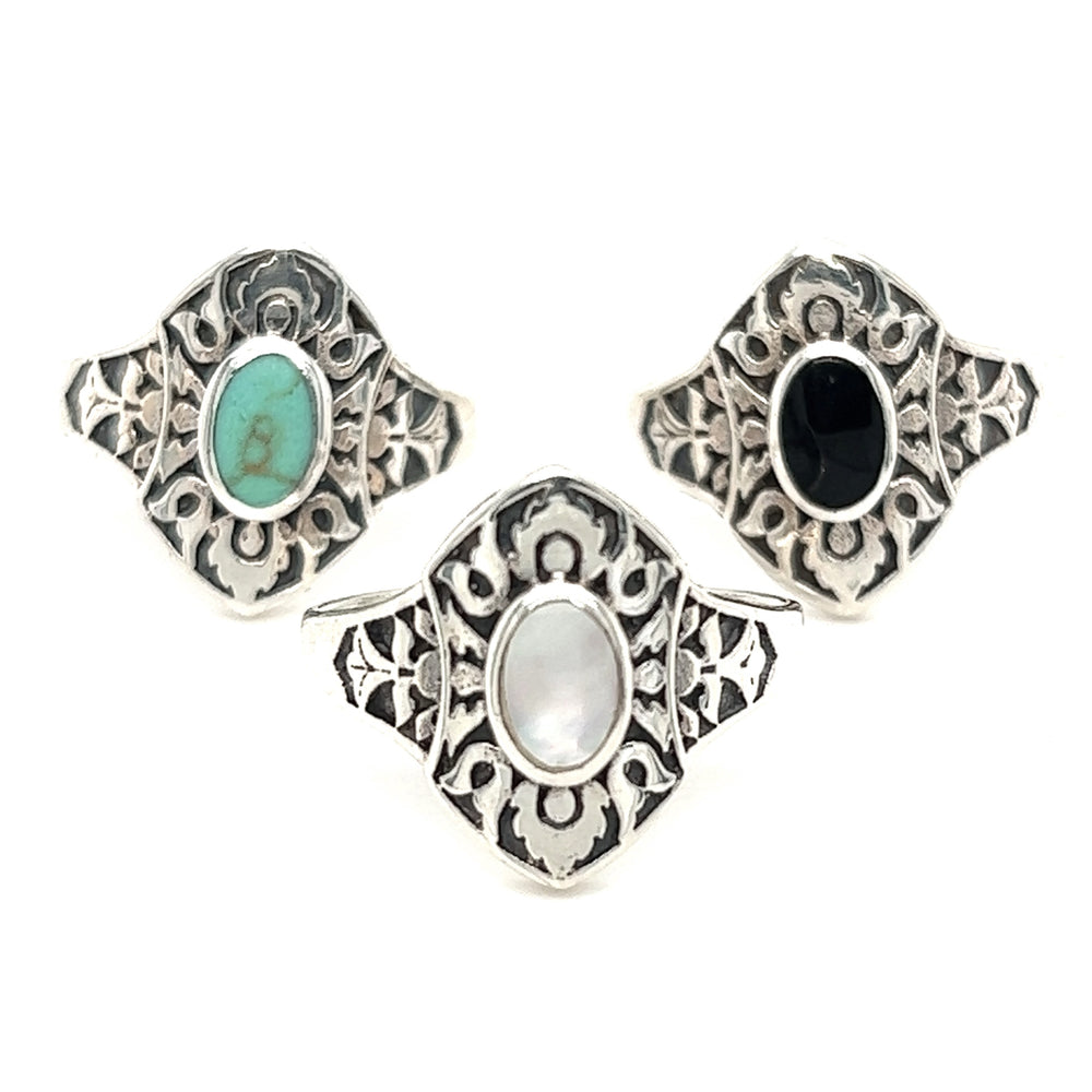 Three Marquise Shield Rings With Inlaid Stones in sterling silver with turquoise and mother of pearl stones.