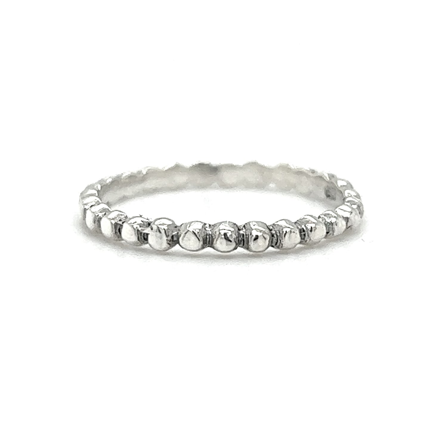 A delicate charm, Tiny Beaded Ring on a white background.