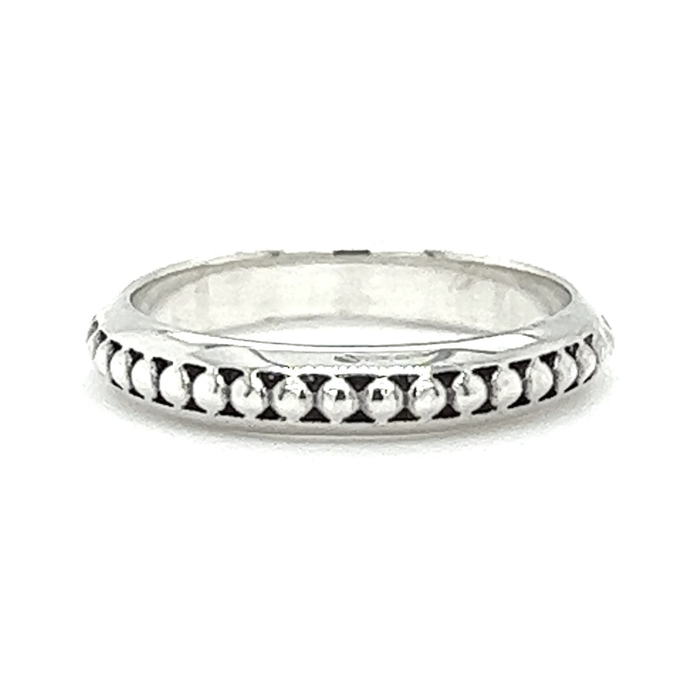 A Silver Band With Beaded Design adorned with a delicate bead design.