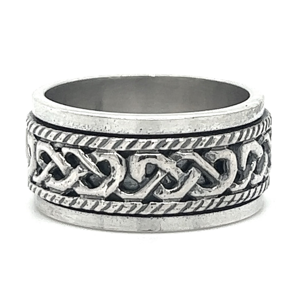 
                  
                    A Spinner Ring With Celtic Knot And Rope Design with a silver band and intricate Celtic knot design.
                  
                