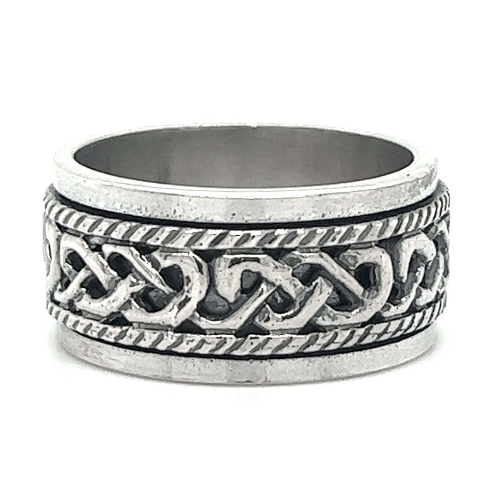 A Spinner Ring With Celtic Knot And Rope Design with a silver band and intricate Celtic knot design.