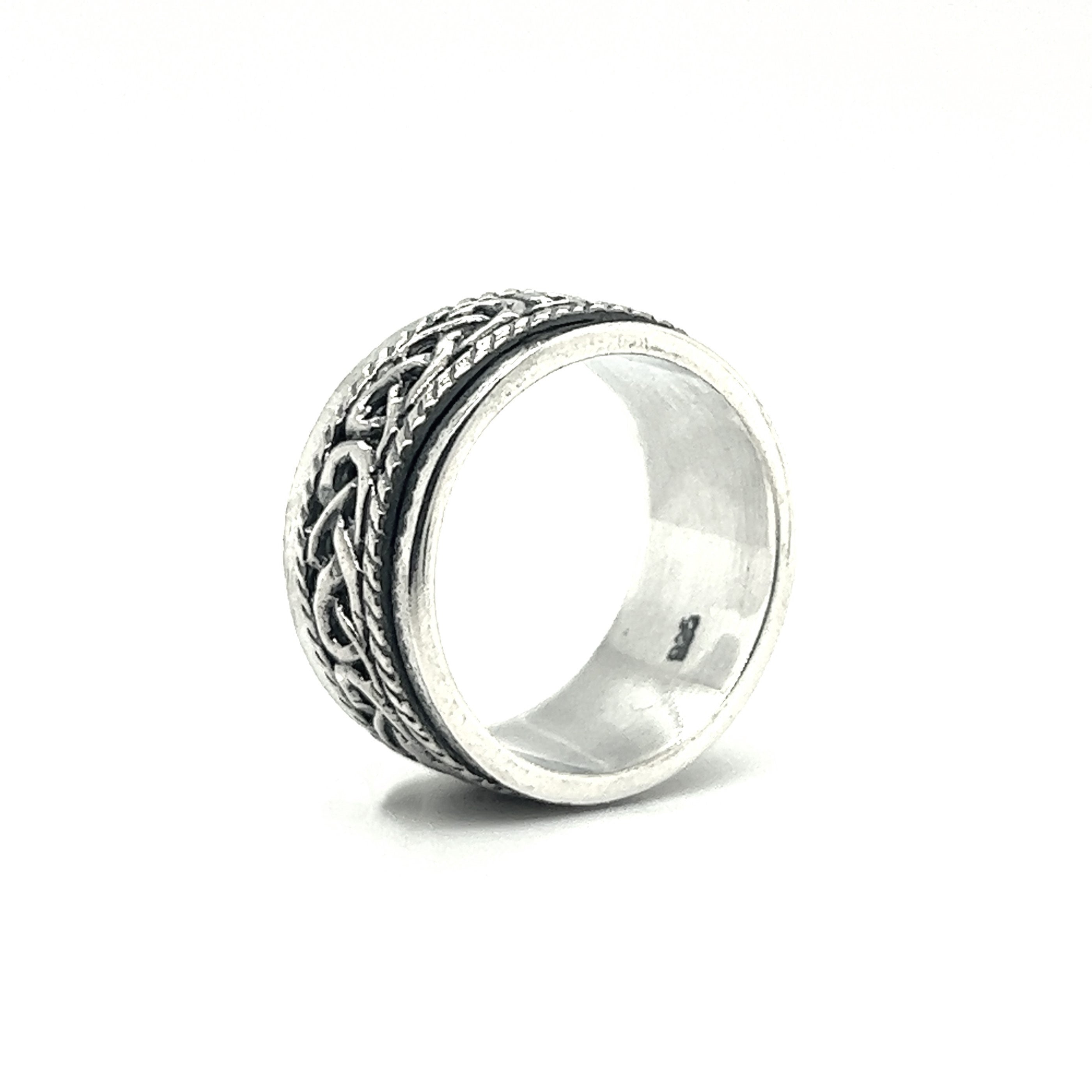 A Spinner Ring With Celtic Knot And Rope Design with an intricate design, featuring a fidget feature.