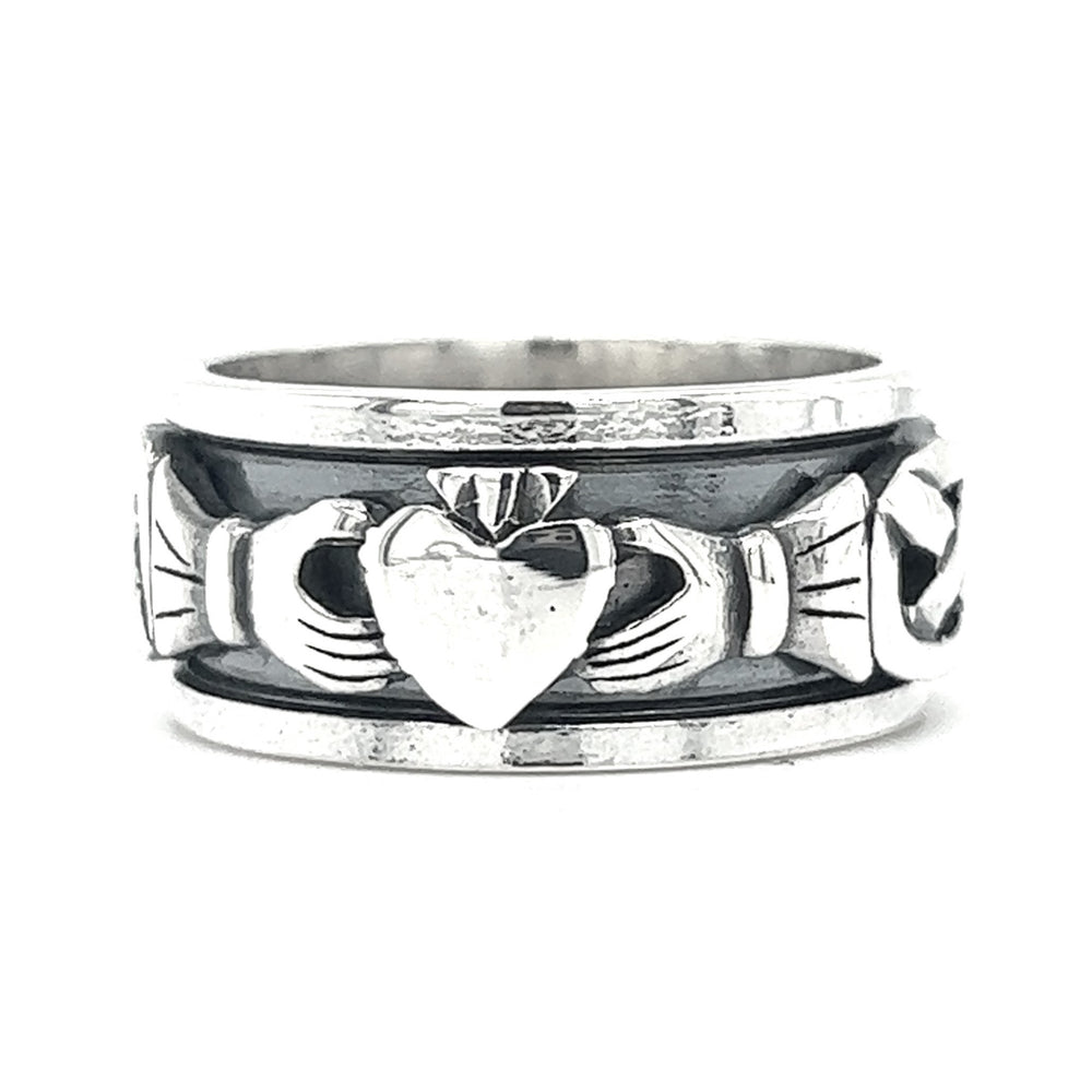 A silver Bold Claddagh Spin Ring with a heart on it.