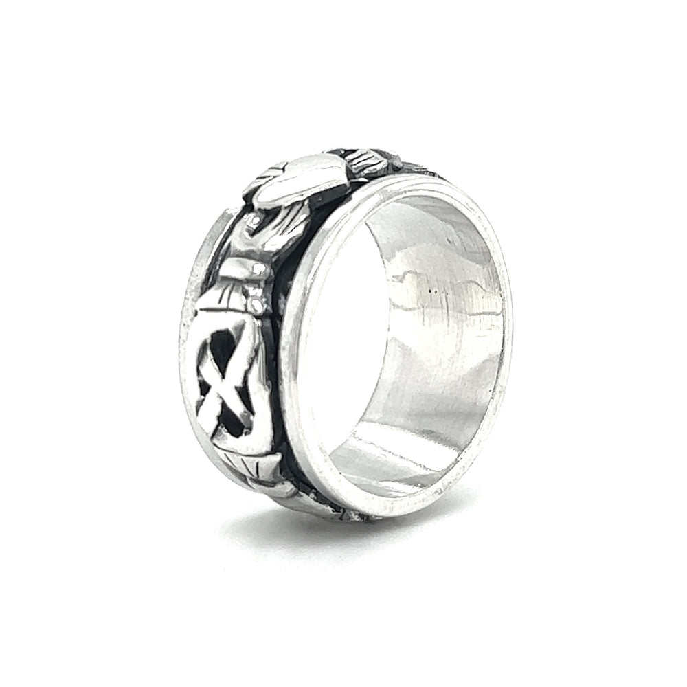 
                  
                    A Bold Claddagh Spin Ring.
                  
                