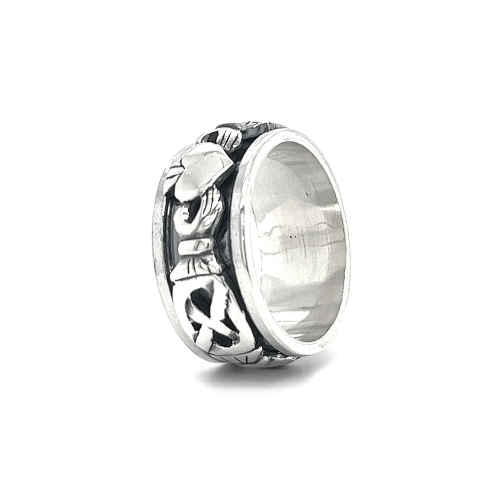 
                  
                    A silver Bold Claddagh Spin Ring with a celtic design on it.
                  
                