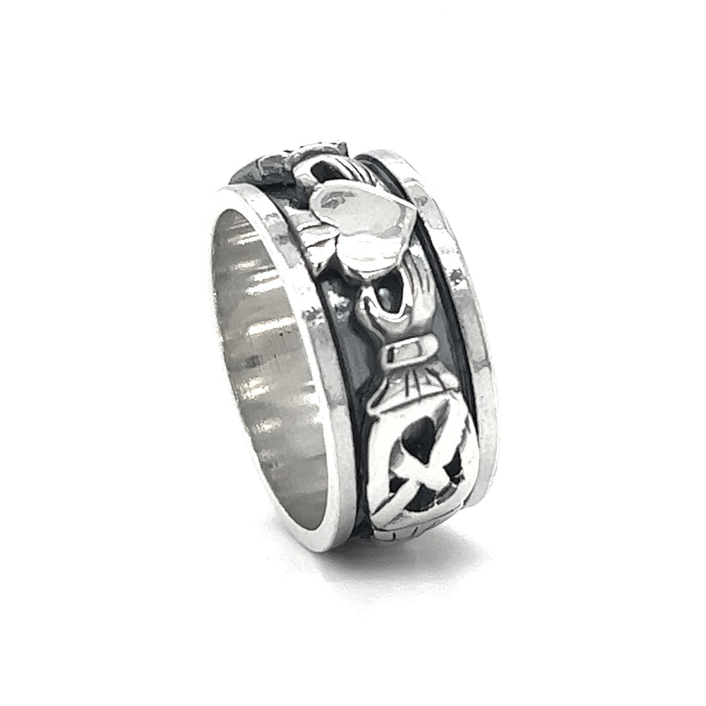 
                  
                    A silver Bold Claddagh spin ring with a masculine design.
                  
                