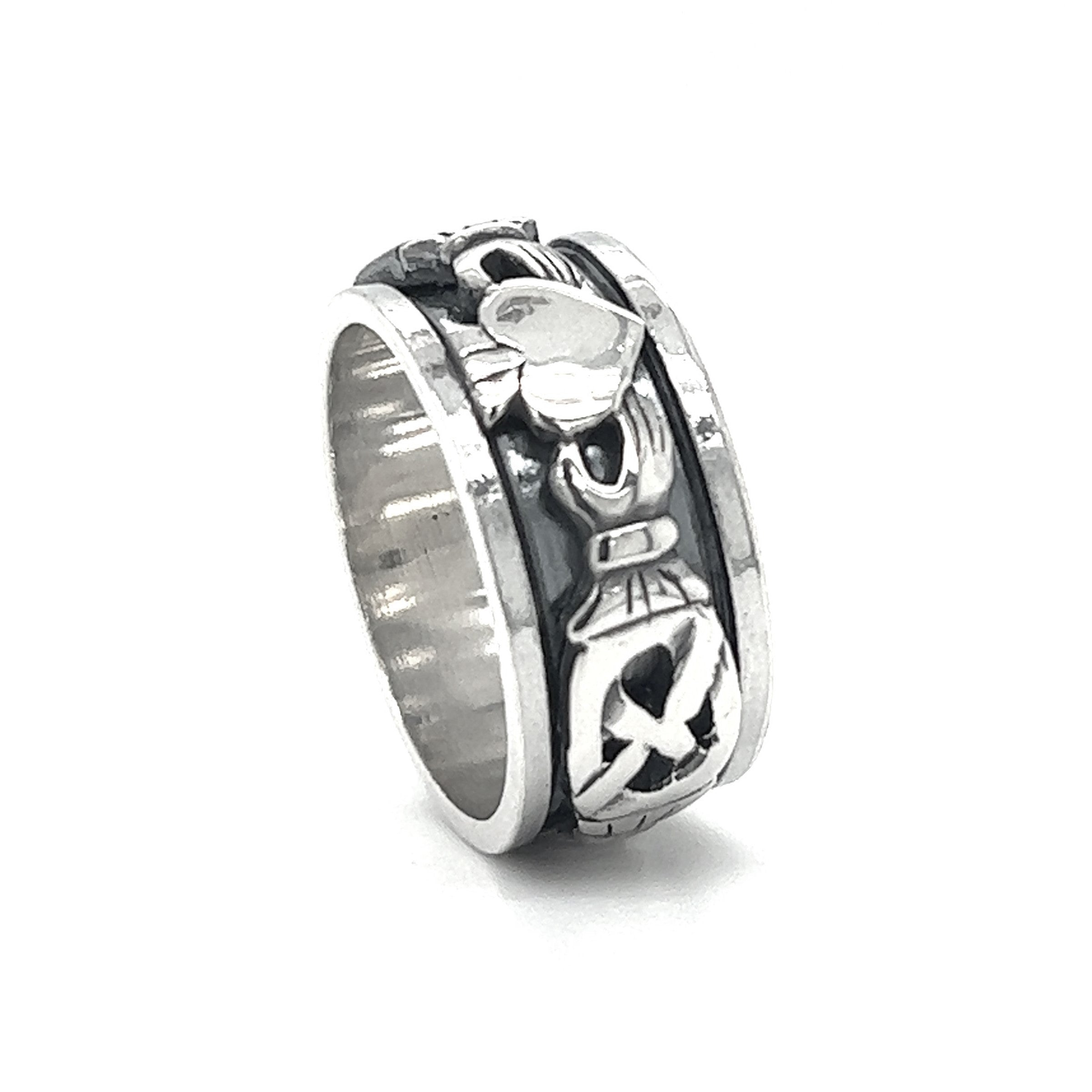 A silver Bold Claddagh spin ring with a masculine design.