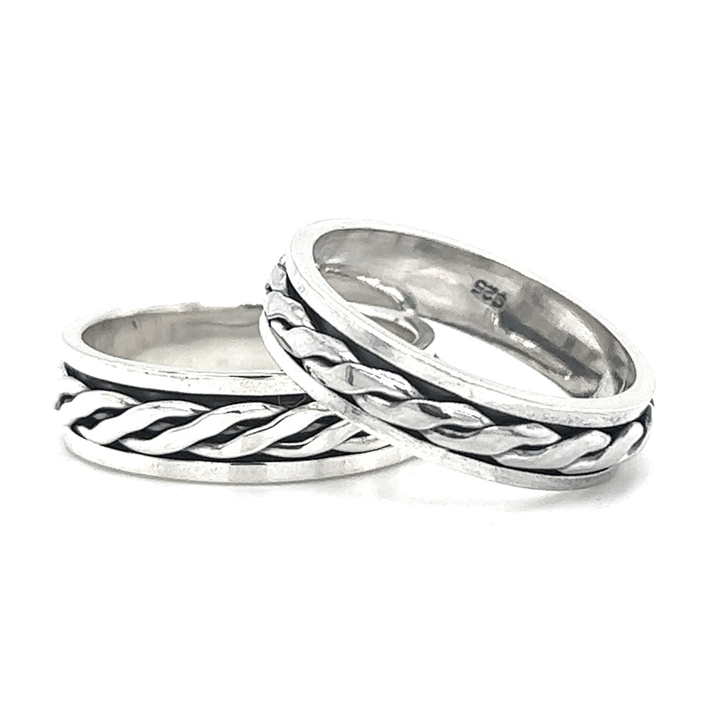 Two sleek silver spinner bands with flat weave designs, offering a calming effect and stress relief.