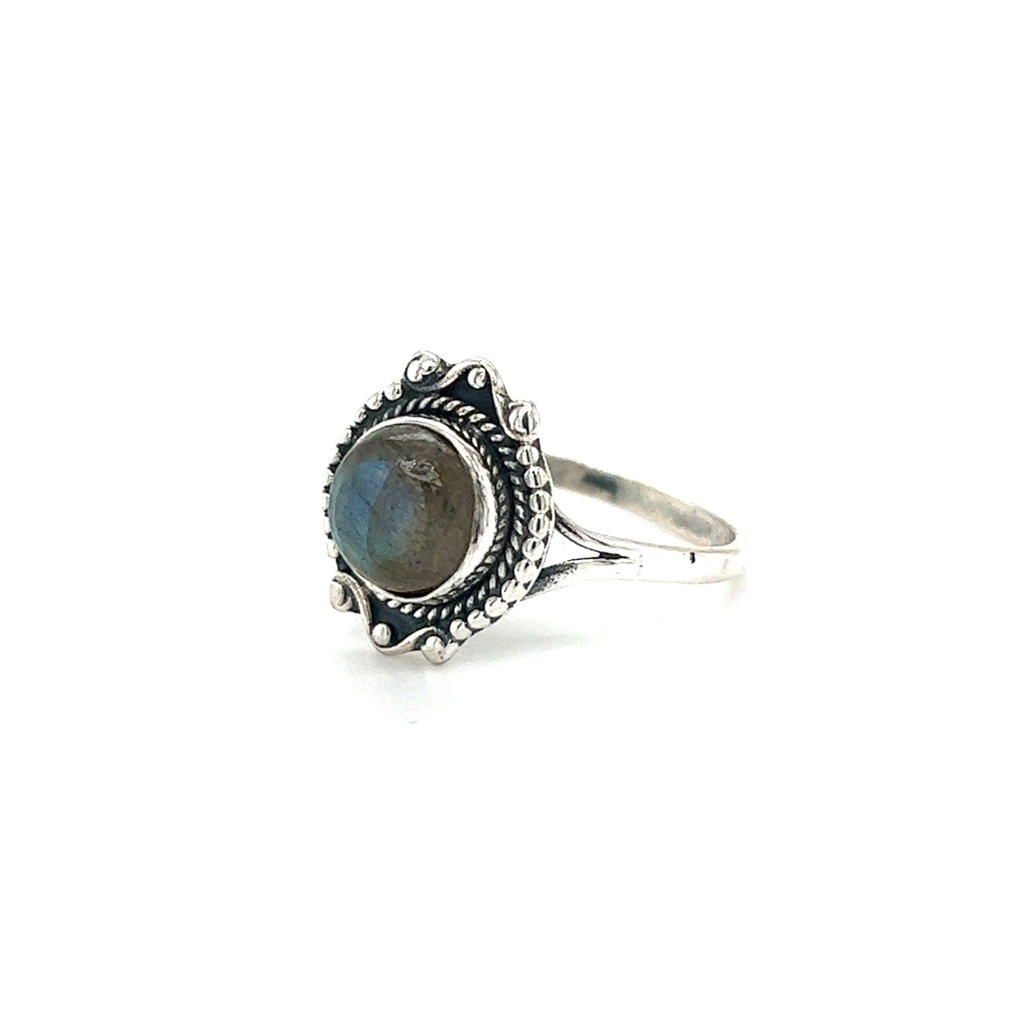 
                  
                    A Round Gemstone Ring With Vintage Setting featuring an ornate band and a round, polished gemstone center exudes bohemian sophistication.
                  
                