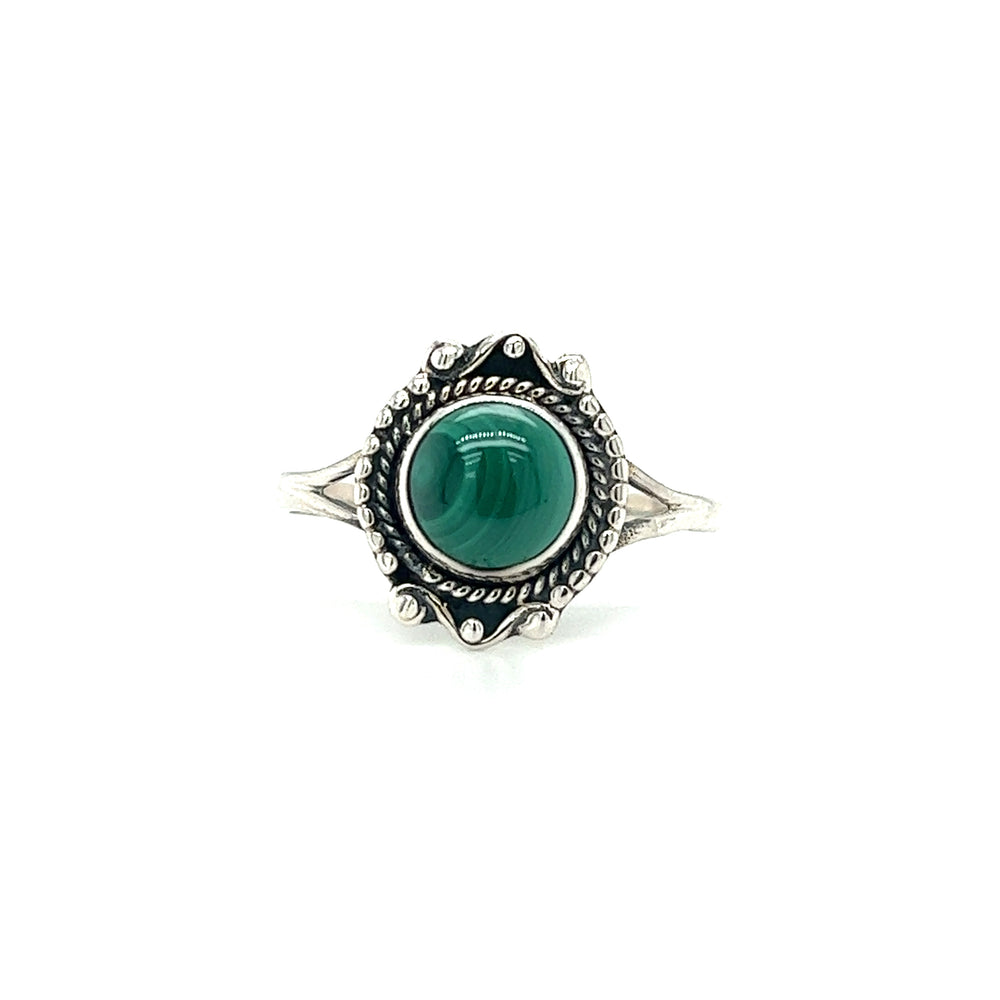 
                  
                    A Round Gemstone Ring With Vintage Setting crafted from sterling silver, featuring an ornate design with a large green gemstone at its center, embodying Bohemian jewelry elegance.
                  
                