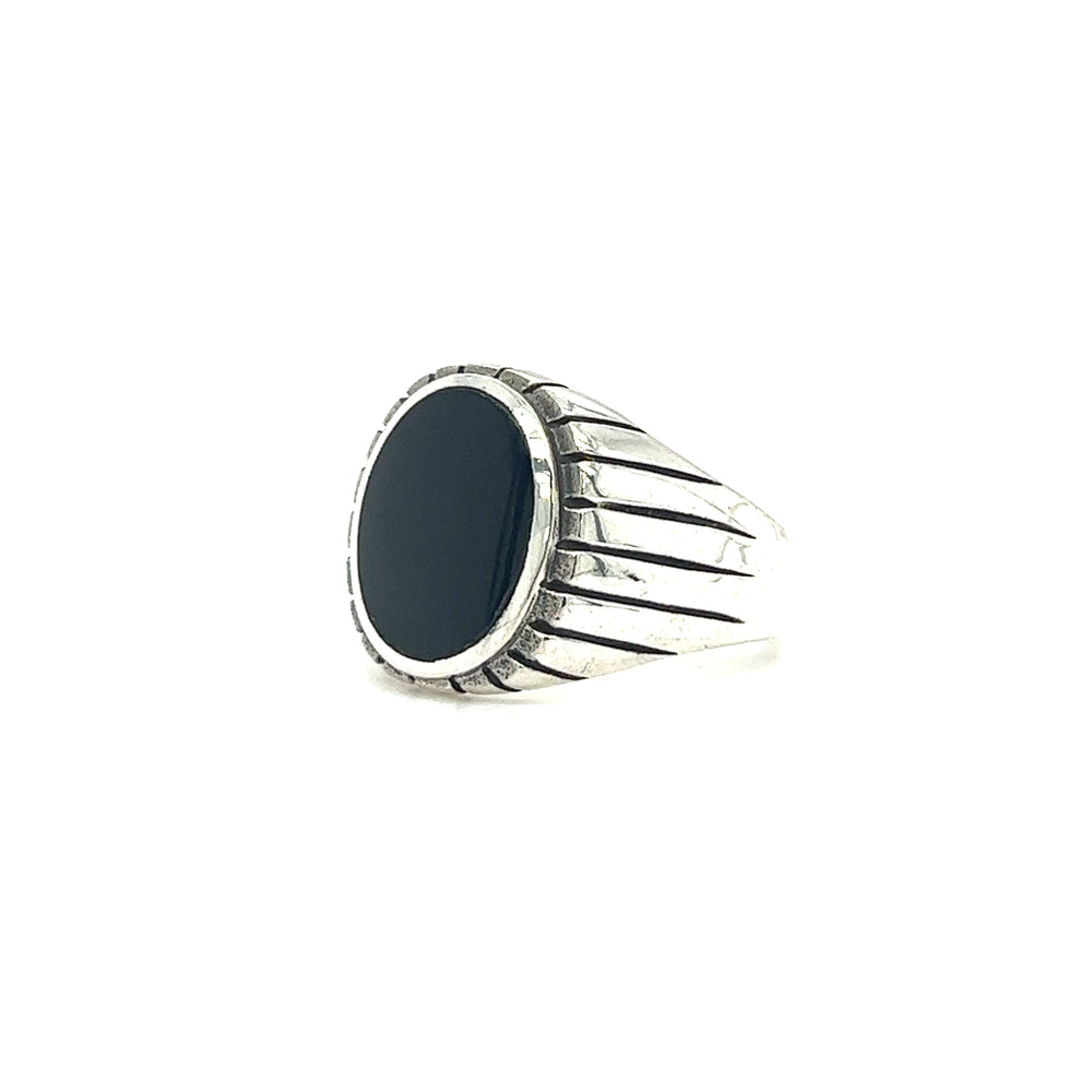 
                  
                    A statement Oval Onyx Ring With Fine Oxidized Scale Pattern for men, featuring a silver band and a striking black onyx stone.
                  
                