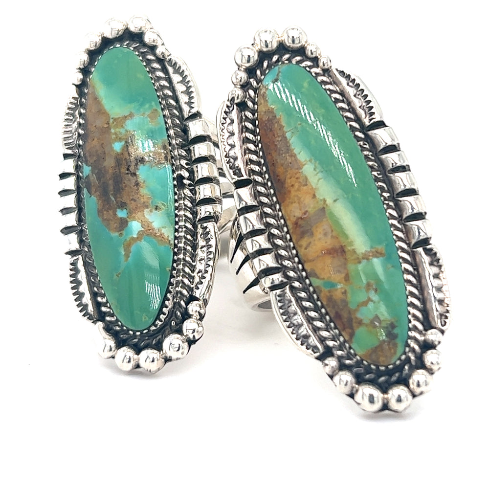 A pair of Statement Native American Turquoise Rings in sterling silver.