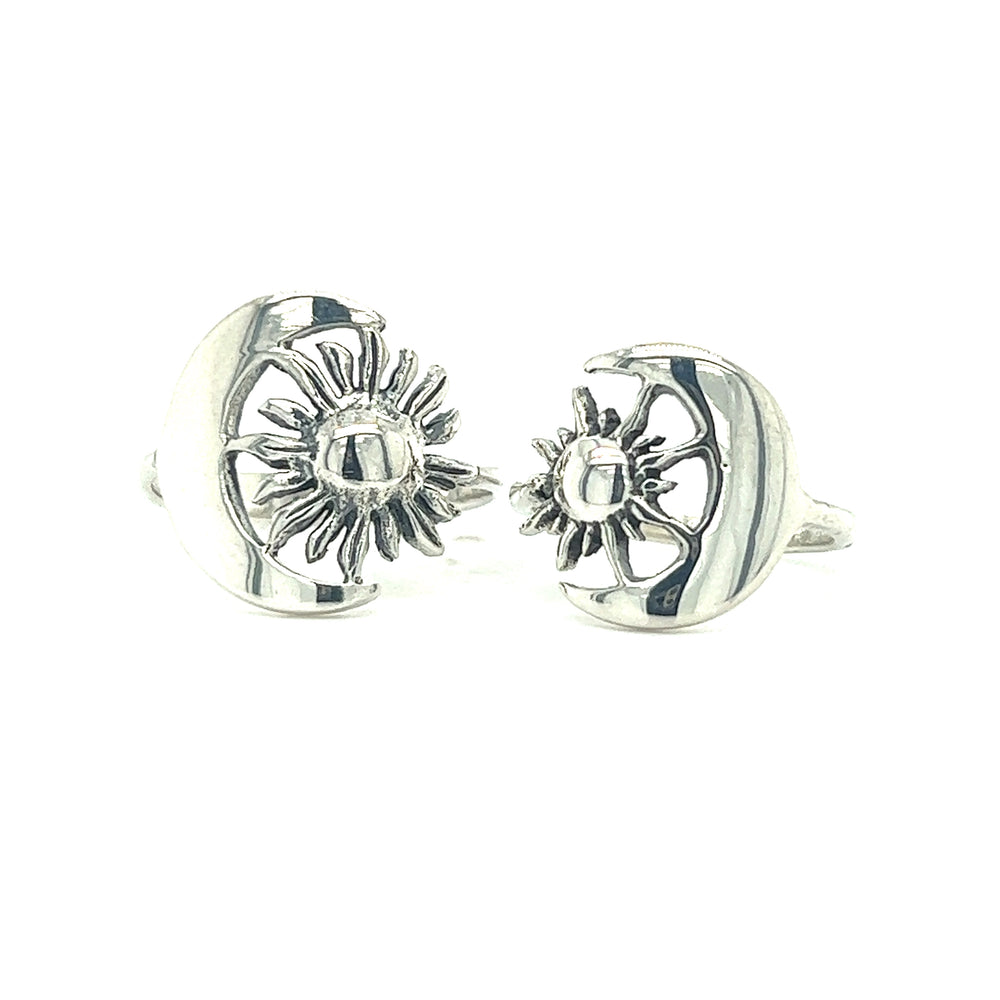 A pair of Striking Sun and Moon Rings from Super Silver, with celestial bodies representing cosmic balance.