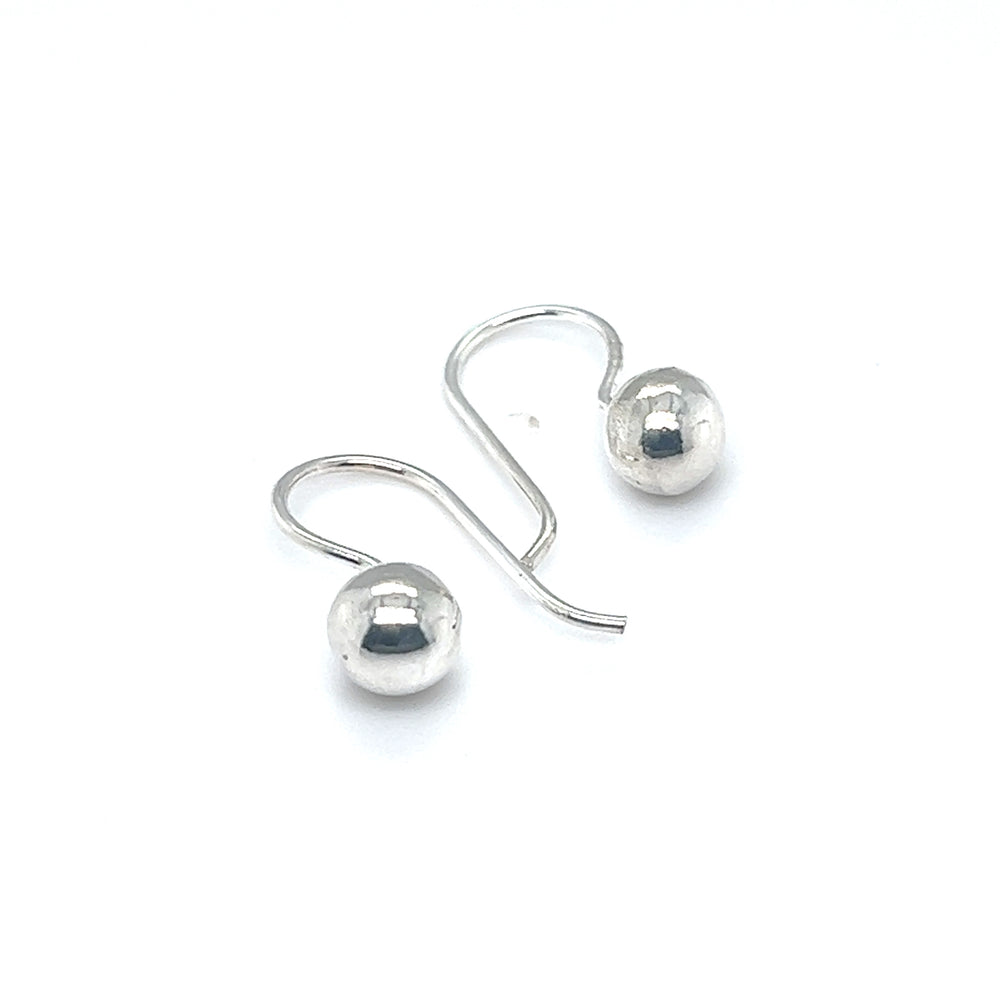 
                  
                    Timeless sophistication embodied in a pair of Super Silver Dainty Fixed Ball Earrings against a serene white background.
                  
                